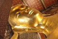 Reclining buddha gold statue face at wat pho in bangkok Royalty Free Stock Photo