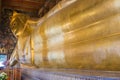 Reclining Buddha gold statue face at Wat Pho, Bangkok, Thailand Royalty Free Stock Photo