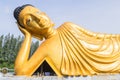 Reclining Buddha gold statue at Phuket, Thailand Royalty Free Stock Photo