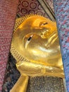 Reclining Buddha statue at Wat Pho in Bangkok, Thailand Royalty Free Stock Photo