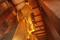 Reclining Gold Buddha statue with close up on the face. Wat Pho, Bangkok, Thailand, Asia Royalty Free Stock Photo