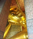 Reclining golden buddha, Wat Phra Chetuphon Watpho, Bangkok, Thailand Royalty Free Stock Photo