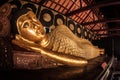 Reclining lying Buddha statue at Buddhist temple in Thailand Royalty Free Stock Photo