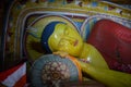 Reclining statue of Buddha in the rock temple of the Isurumuniya Monastery, Anuradhapura, Sri Lanka