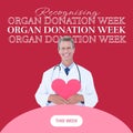 Recognising organ donation week text and happy caucasian male doctor holding pink heart