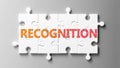 Recognition complex like a puzzle - pictured as word Recognition on a puzzle pieces to show that Recognition can be difficult and