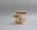Recognize Signs of Stress symbol. Concept words Recognize Signs of Stress on wooden blocks. Beautiful grey background. Medicine