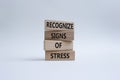 Recognize Signs of Stress symbol. Concept words Recognize Signs of Stress on wooden blocks. Beautiful white background. Medicine