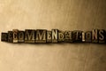 RECOMMENDATIONS - close-up of grungy vintage typeset word on metal backdrop