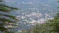 Recong Peo City: View from distant hills amid forest cover in Himachal Pradesh, showcasing the scenic beauty of the hillside