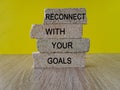 Reconnect with your Goals symbol. Brick blocks with words Reconnect with your goals.
