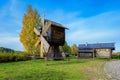 A reconstructed ancient wooden windmill on the shore of the Svir River at a craft and museum tourist centre Verkhniye Mandrogi,