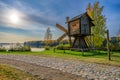 A reconstructed ancient wooden windmill on the shore of the Svir River at a craft and museum tourist centre Verkhniye Mandrogi,