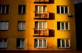 Reconstructed block of flats at sunset with sun shining only at one part of the house, the other ones are in shadow Royalty Free Stock Photo