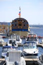 Wooden battleship and motor yachts in the yacht port