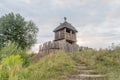 Reconstruction historical village wooden tower with palisade