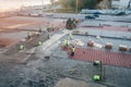 Reconstruction and improvement of city square. Construction workers placing stone tiles Royalty Free Stock Photo