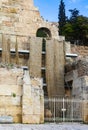 Reconstruction of the Odeon of Herodes Atticus near the Acropolis of Athens with wet dirty swathes of fabric hanging from scaffold
