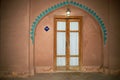 Reconstruction of old arched tile decorations around doors and windows, The Gouged castle, Isfahan. Royalty Free Stock Photo
