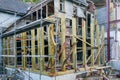 Reconstruction of an old house, replacement of roof and wall wooden structures