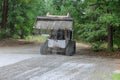 During the reconstruction of an old road, a Bobcat tractor is moving and unloading gravel Royalty Free Stock Photo