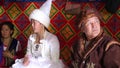 Steppe people rest in a yurt