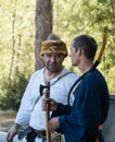 The reconstruction participant of the `Viking Village` talk with each other in the camp in the forest near Ben Shemen in Israel