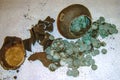 Reconstruction of a placer of silver coins of the 17th century and a jug in the form of a treasure