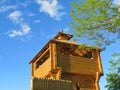 Reconstruction of a wooden fortification on the background blue sky Royalty Free Stock Photo