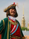 Reconstructor in military costume from the 18th century on the background the spire of the Peter and Paul Cathedral. Royalty Free Stock Photo