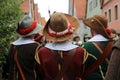 Reconstructors in musketeers clothes on a city holiday Royalty Free Stock Photo