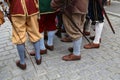 Reconstructors in musketeers clothes on a city holiday Royalty Free Stock Photo