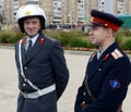 Reconstructors in the old Soviet uniform of officers of the police road patrol service at the exhibition of old cars