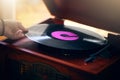 Record player, hand and woman playing music in home living room. Classic technology, retro and female putting vintage Royalty Free Stock Photo