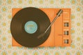 Record player on top of flower wallpaper Royalty Free Stock Photo