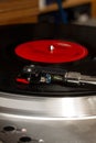 Record usb player turntable with its stylus running on vinyl record.