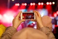 Recording a concert with mobile phone, silhouette of hands with smartphone Royalty Free Stock Photo