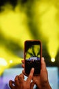 Recording a concert with mobile phone, silhouette of hands with smartphone Royalty Free Stock Photo