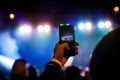 Recording a concert with mobile phone, silhouette of hands with smartphone Royalty Free Stock Photo