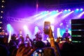 Recording a concert with mobile phone, silhouette of hands with smartphone Royalty Free Stock Photo