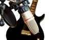 Recording studio microphone with black guitar Royalty Free Stock Photo