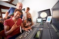 Recording studio, rock sign and portrait of people for music, radio and audio with musical instruments. Hand emoji Royalty Free Stock Photo