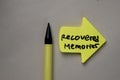 Recovered Memories write on sticky notes isolated on office desk