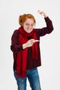 Cropped portrait of young excited Caucasian girl recovering from a cold isolated over white background. Normal body