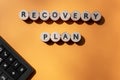 Recovery plan inscription and calculator on office desk. Business and marketing concept. Top view. Banner, copy space Royalty Free Stock Photo