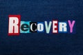 RECOVERY text word collage, colorful fabric on blue denim, abuse and treatment concept Royalty Free Stock Photo