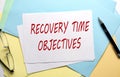 RECOVERY TIME OBJECTIVE text on paper on the colorful paper background