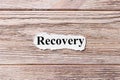 Recovery of the word on paper. concept. Words of Recovery on a wooden background Royalty Free Stock Photo