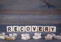 Recovery word written on wood block