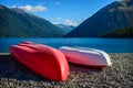 A recreation area with a couple colorful kayaks